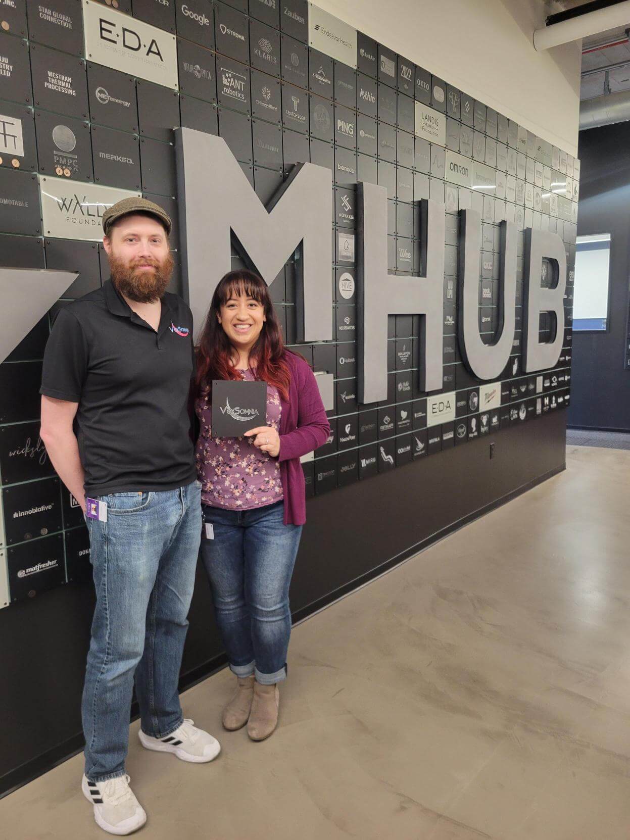 Eric and Becca at the mHUB community event to install new member tiles on the wall